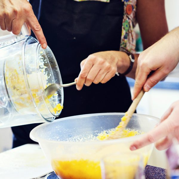 two women stirring, baking