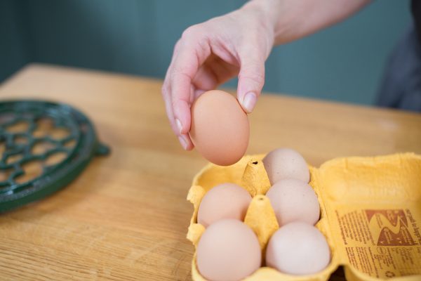 eggs being taken from a carton