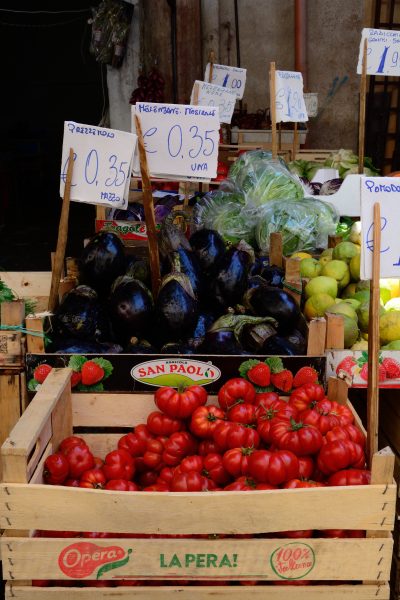 aubergines and tomatoes in crates