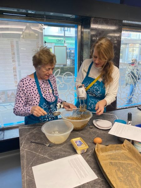 2 participants add ingredients into a bowl and mix