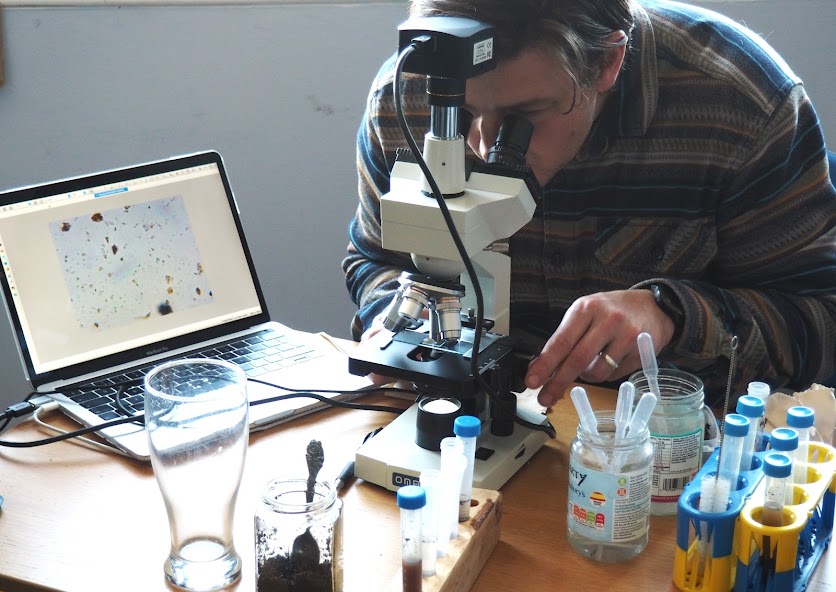 Perry from Soil Redemption, looking under the microscope at the first annual Loving Living Soil event.