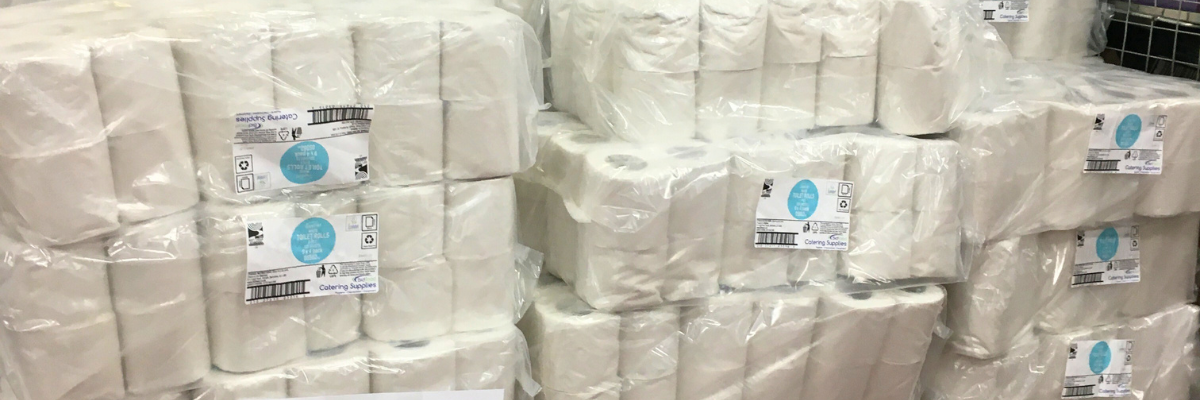 A large stack of toilet rolls, delivered from the food hub to households during the COVID-19 pandemic